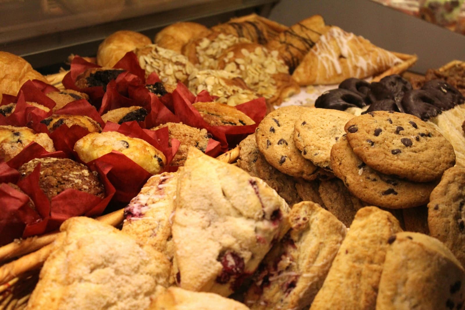Biscuit jars and pastries in the bakery display case